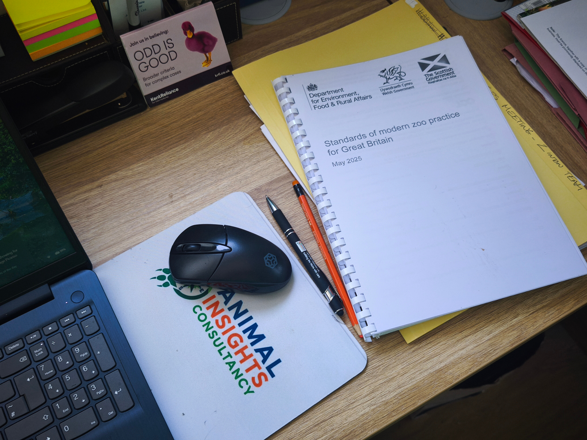 Animal Insights Consultancy desk with a printed copy of the Defra Standards of Modern Zoo Practice for Great Britain, May 2025